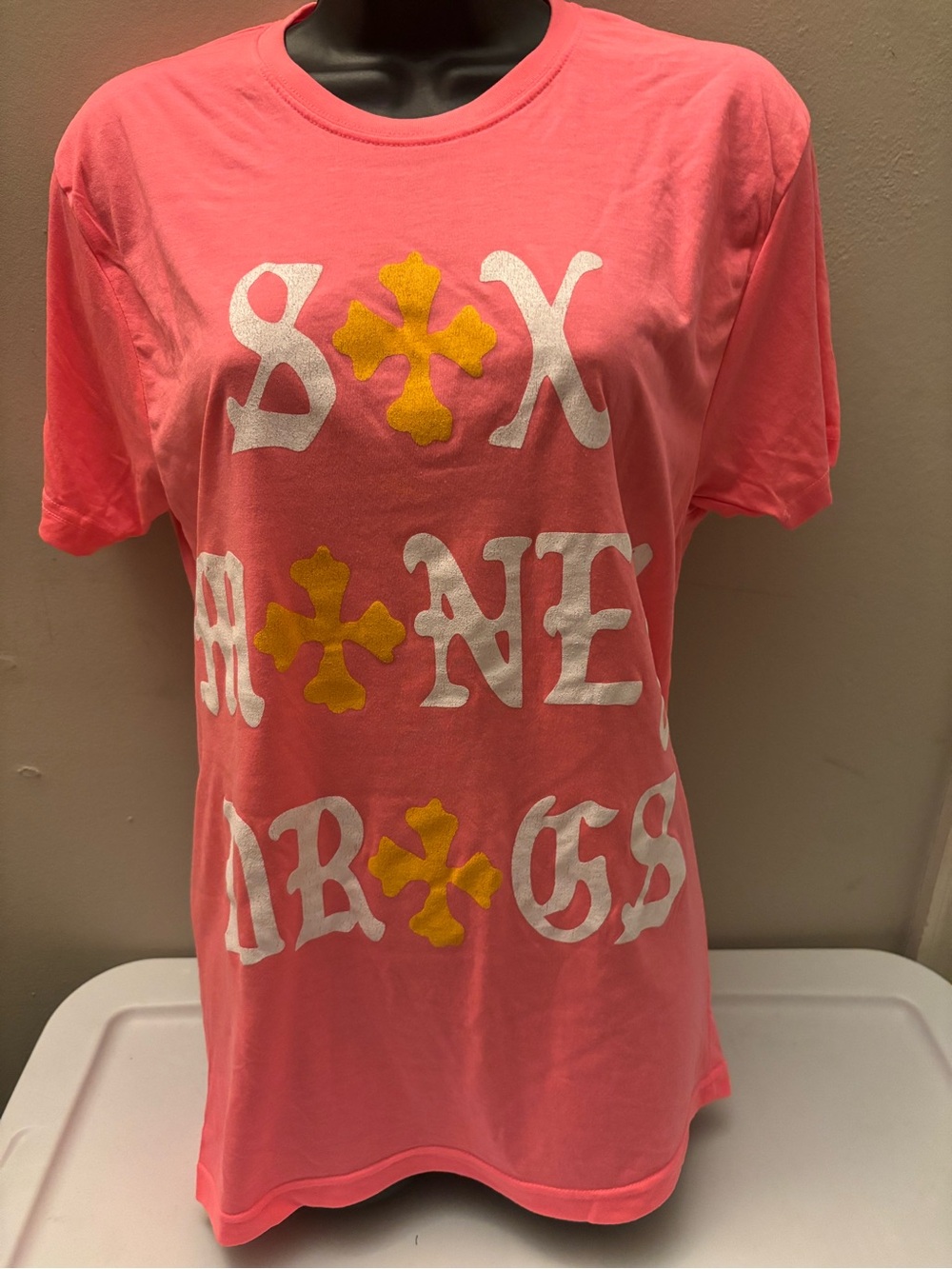 LUCKI Concert Tour Brand Coral Pink Graphic Tee with White and Yellow Accents